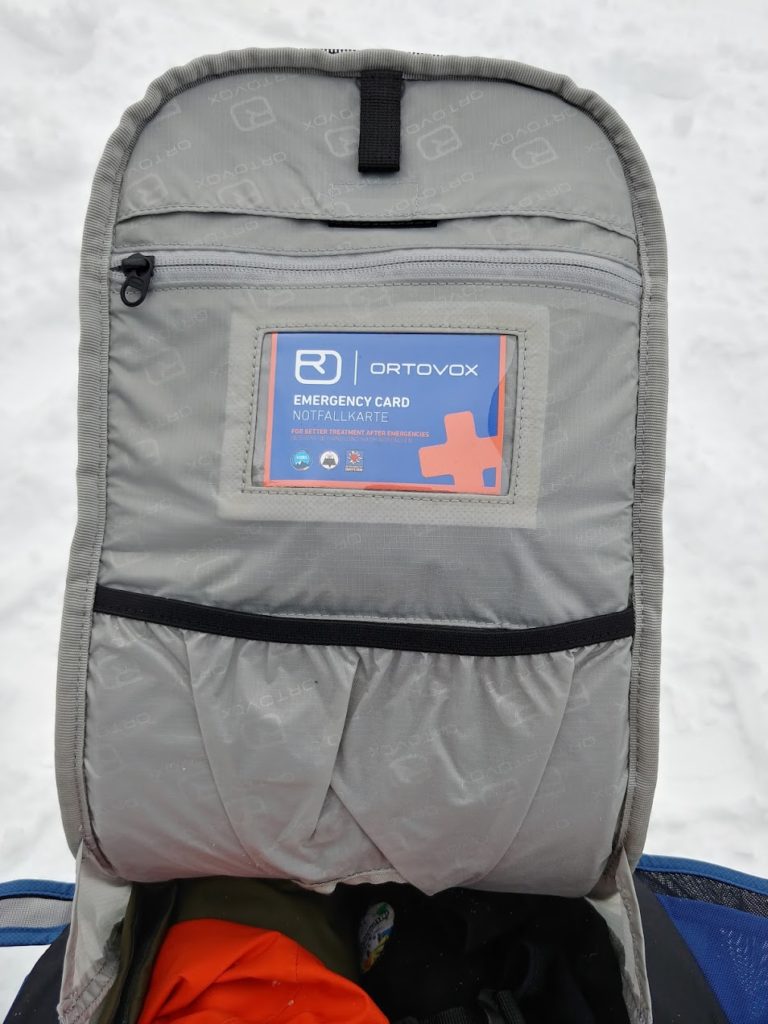 ortovox trace 25 ski touring pack inside of back panel showing emergency card